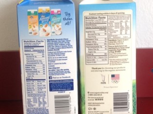 cartons of almond milk and cow's milk