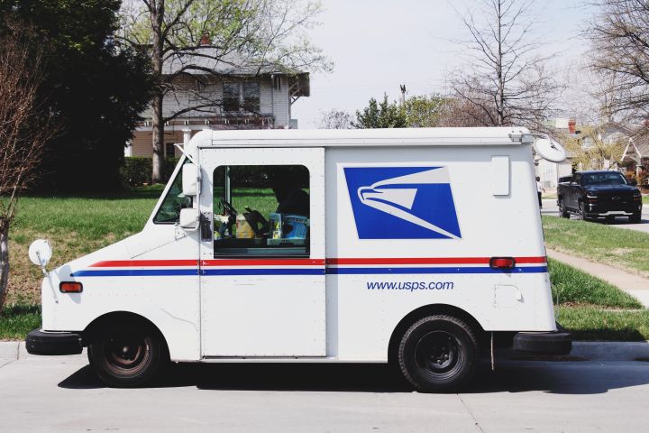 US postal truck delivering the mail