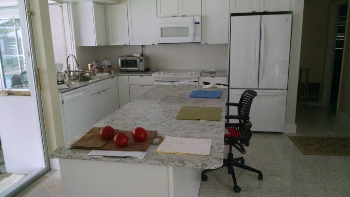 a renovated kitchen with new cabinets and appliances