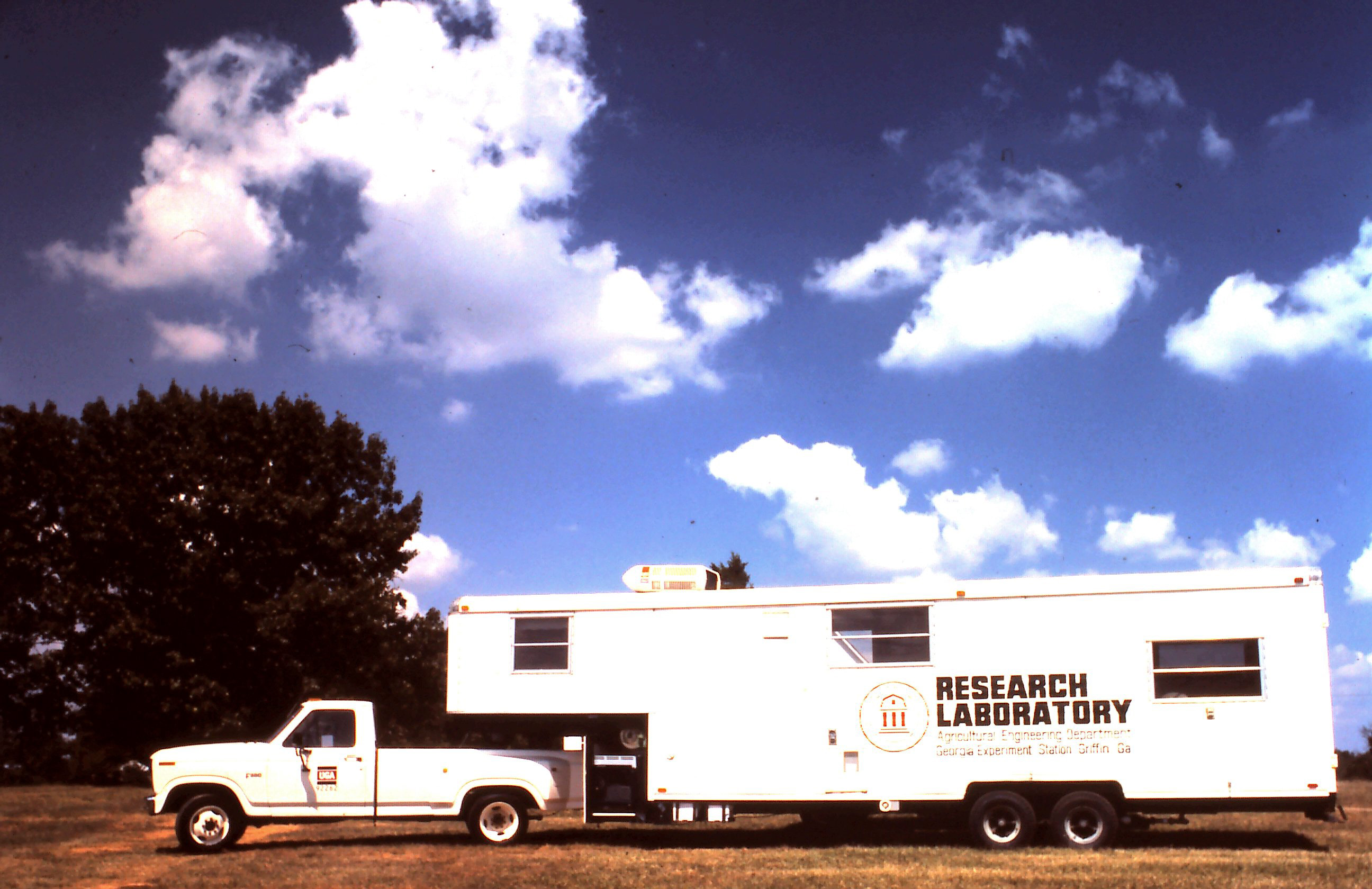 photo of a mobile laboratory hitched on to a pickup truck for following crops during postharvest handling