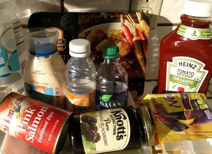 several food packages for water, ketchup, mayonnaise, canned salmon and blackberry jam