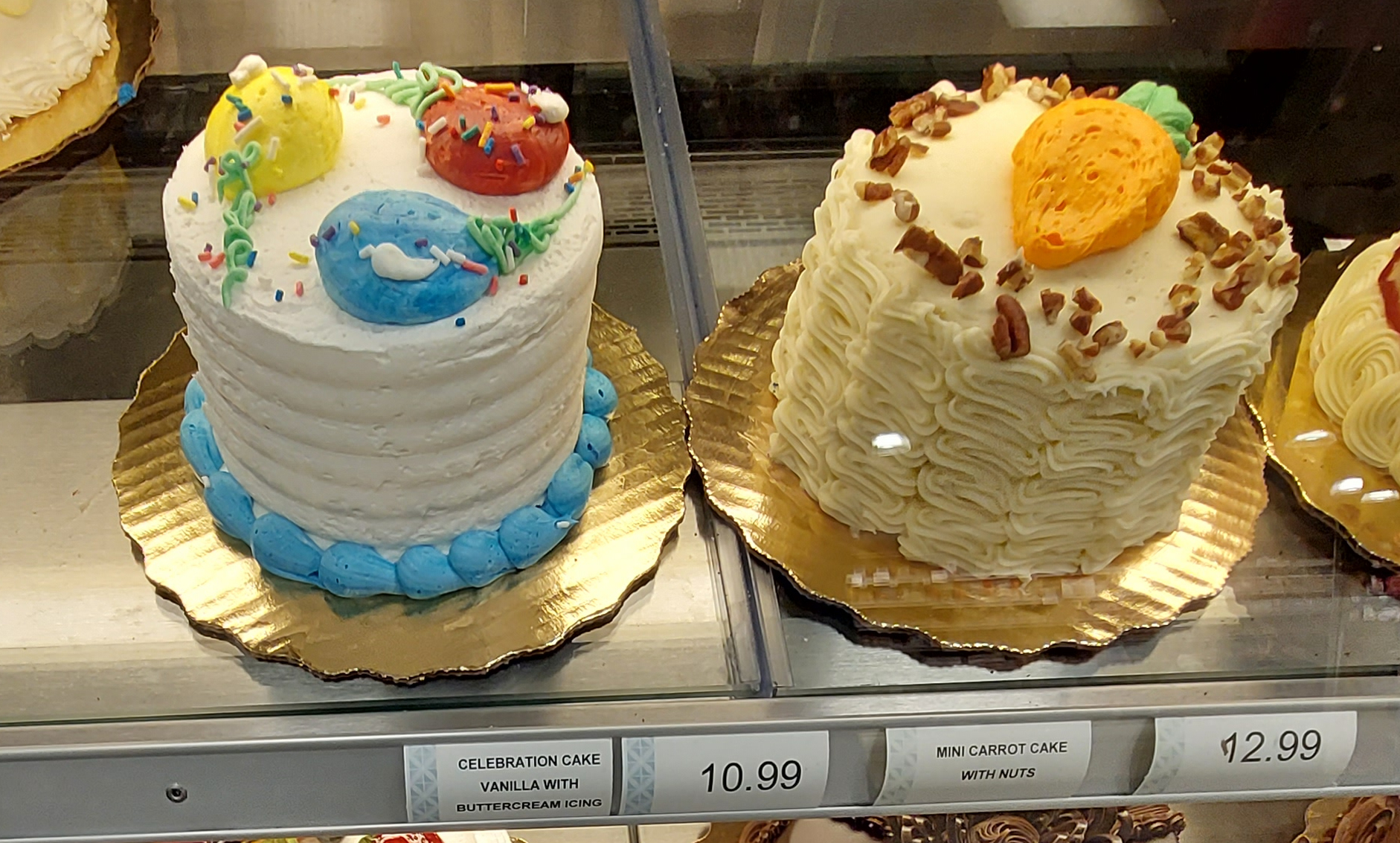 birthday cakes on display in a supermarket