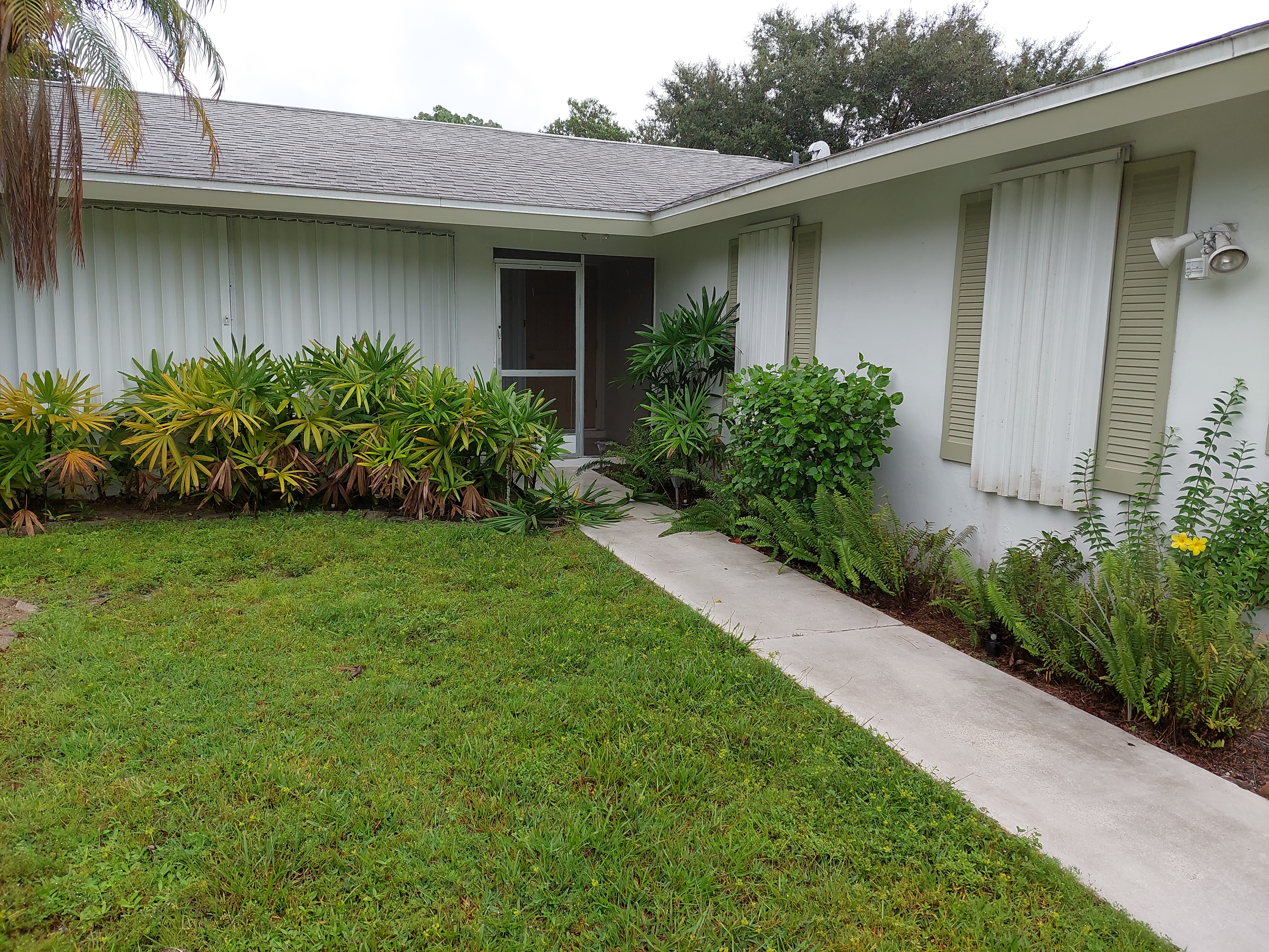 Front of house with all shutters in place.