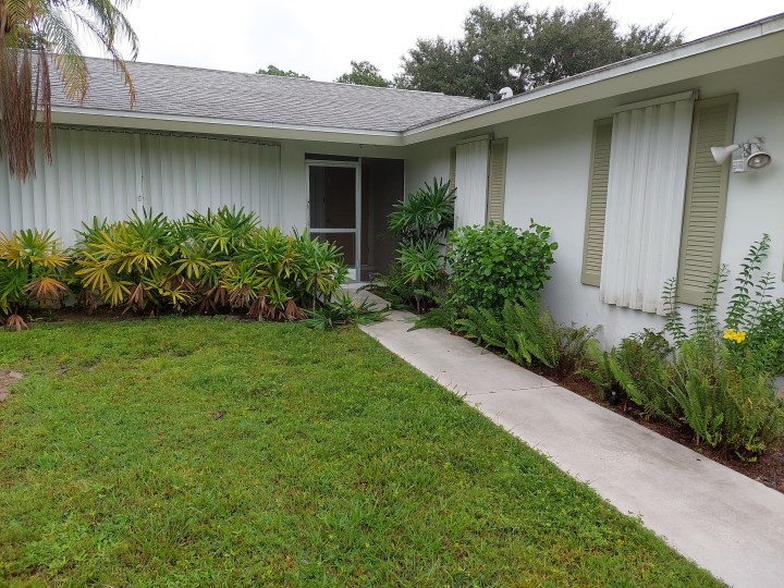 Front of house with all shutters in place.